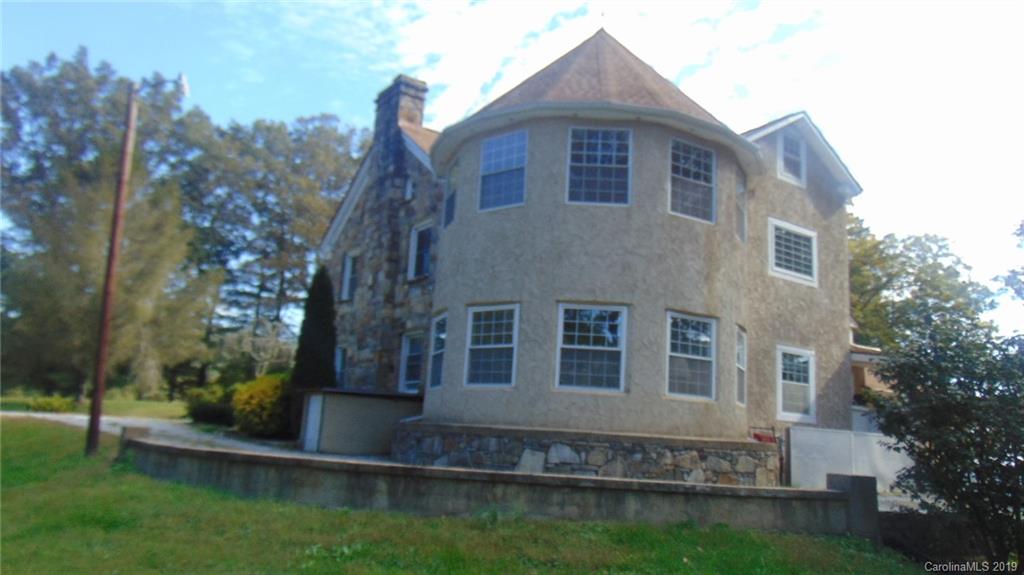3516 Brevard Road Hendersonville, NC 28791 - Photo 17 of 20 a front view of a house with a yard