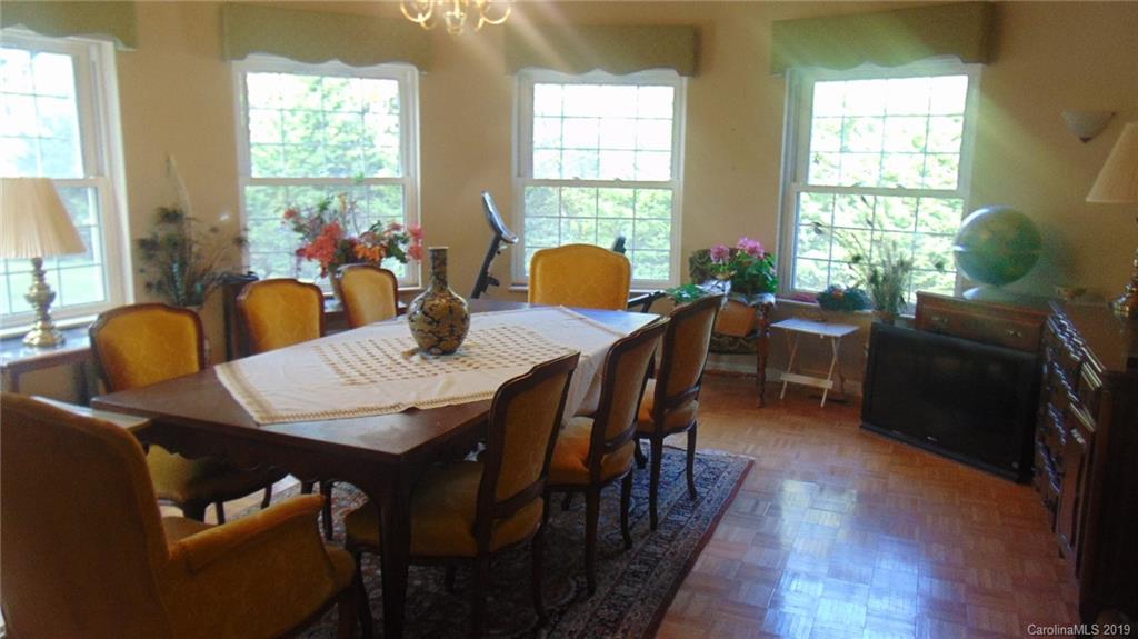 3516 Brevard Road Hendersonville, NC 28791 - Photo 6 of 20 a view of a dining room with furniture and windows