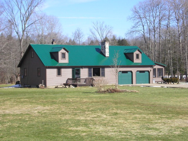 13501 Estes Road Union City, PA 16438 - Photo 1 of 1 a view of a house with a yard and trees in the background