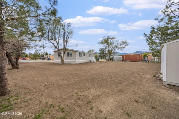 a view of a yard with a house