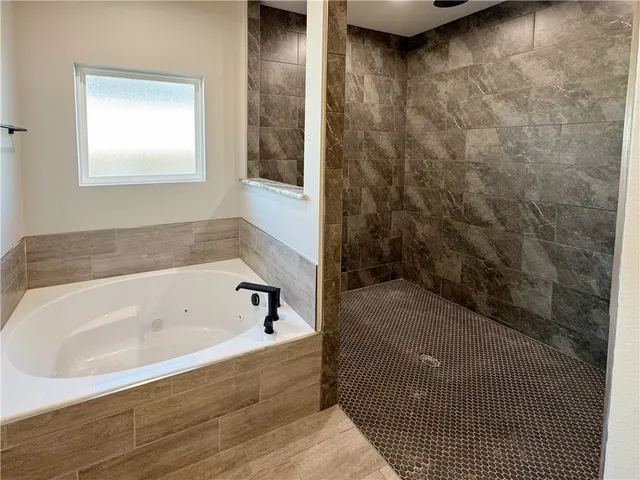 a bathroom with a granite countertop toilet sink and shower