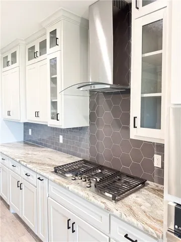 a view of kitchen with granite countertop cabinets