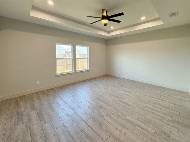 a spacious bathroom with a double vanity sink a mirror and a shower