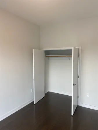 an empty room with wooden floor