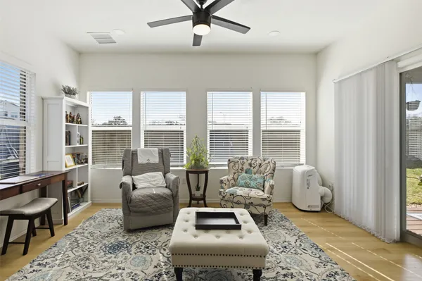 a living room with furniture and windows