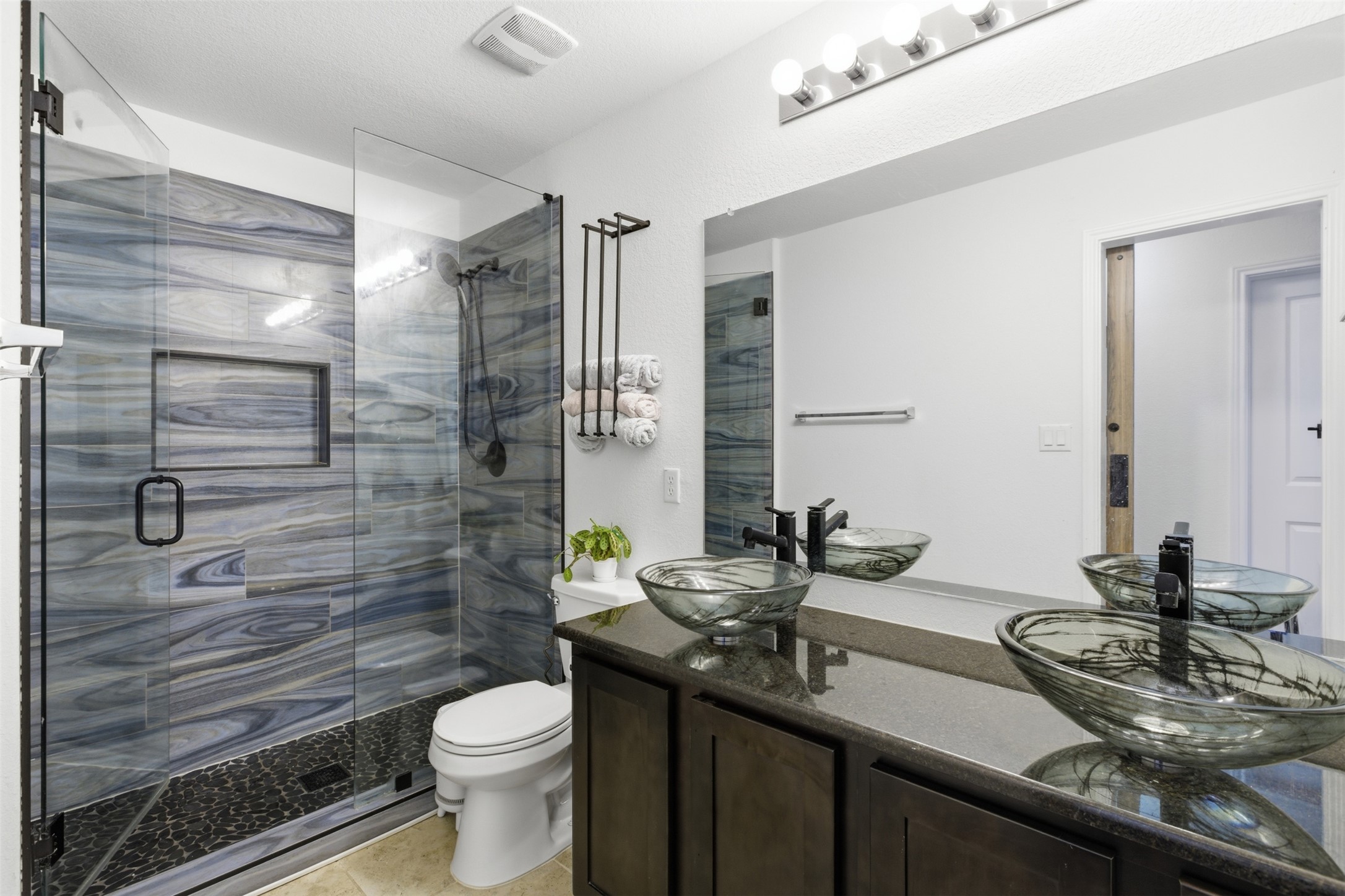 832 Mallow Road Leander, TX 78641 - Photo 16 of 29 Porcelain tile walls
Real slate flooring
Granite countertops
Frameless walk-in shower