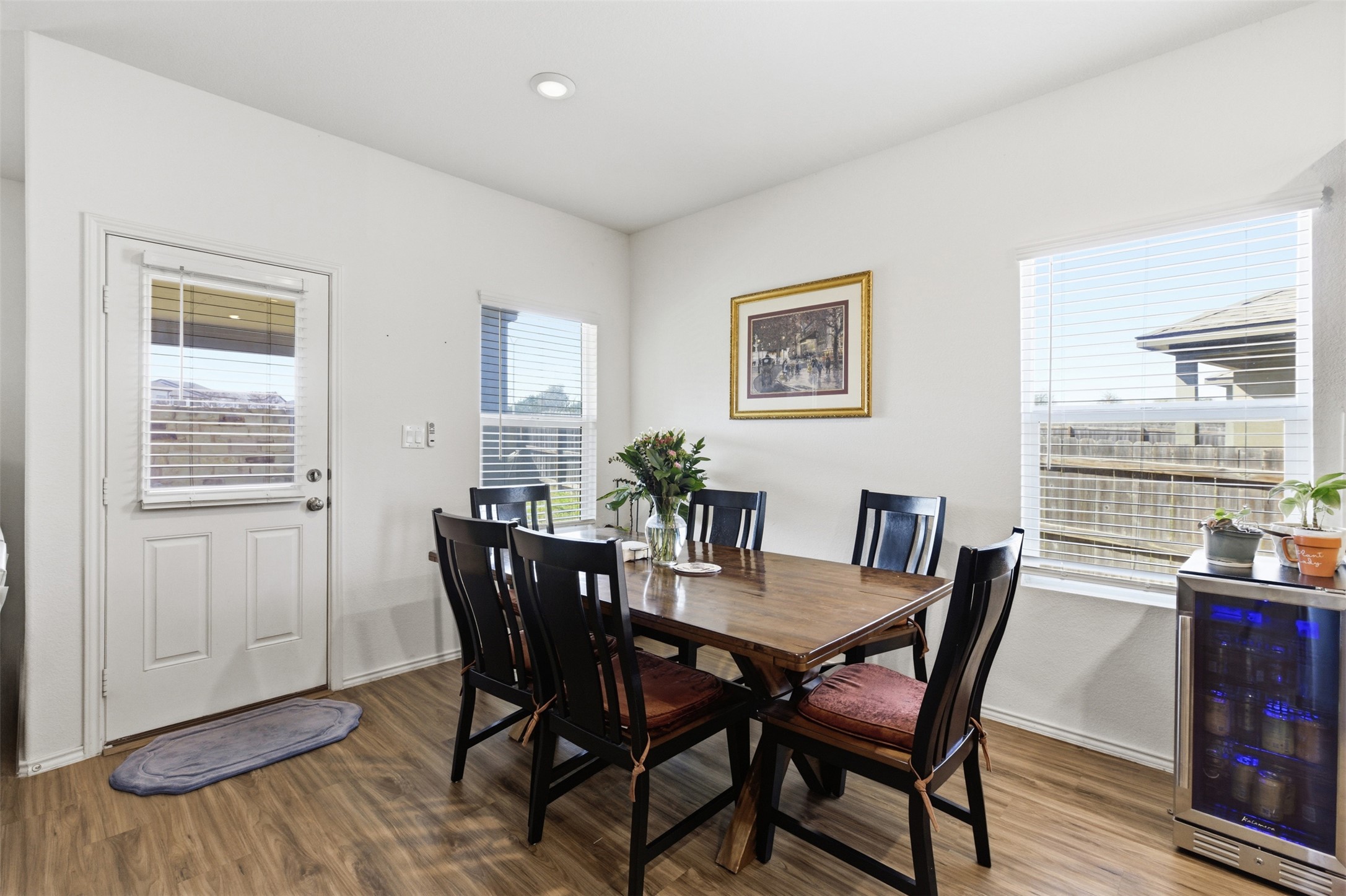 832 Mallow Road Leander, TX 78641 - Photo 23 of 29 Dining room with beverage cooler and dark wood-type flooring