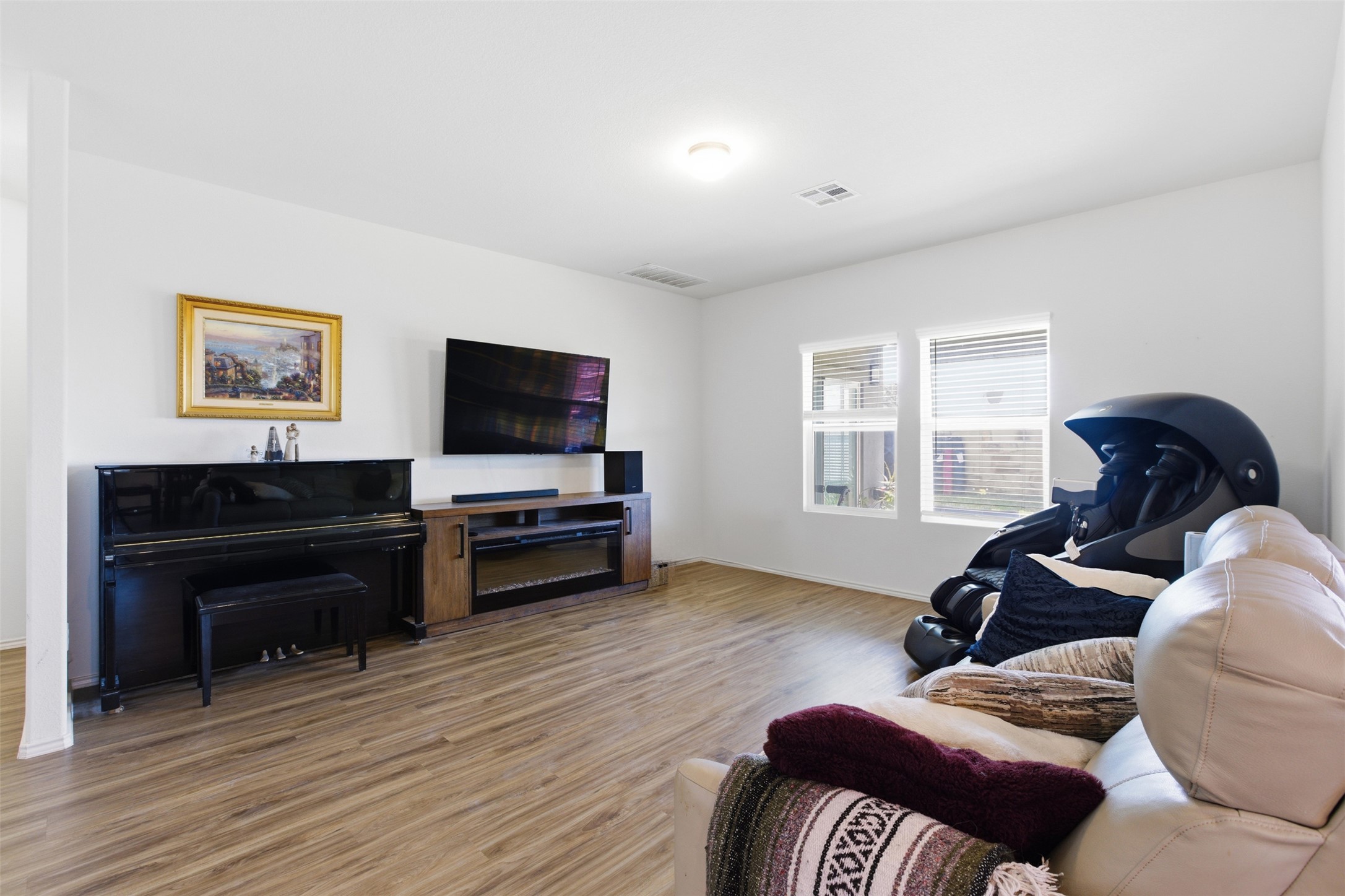832 Mallow Road Leander, TX 78641 - Photo 5 of 29 Living area featuring light wood finished floors and baseboards