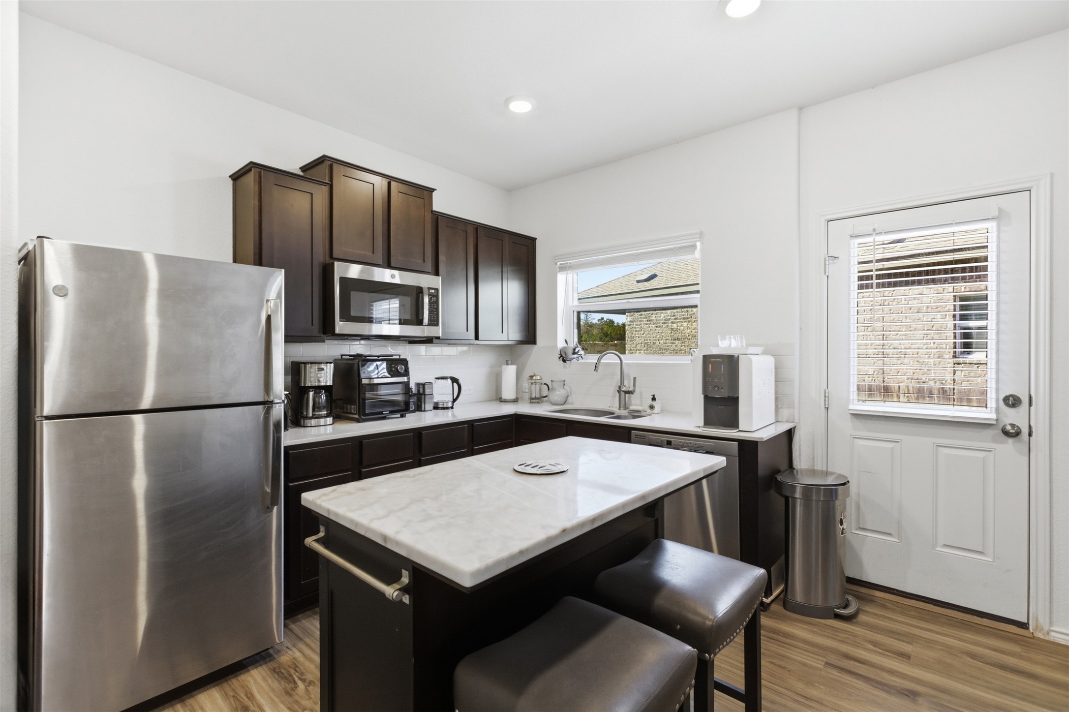 832 Mallow Road Leander, TX 78641 - Photo 8 of 29 NextGen suite includes microwave/convection oven (no cooktop)
NextGen suite includes dishwasher, disposal, full refrigerator, stacked washer/dryer