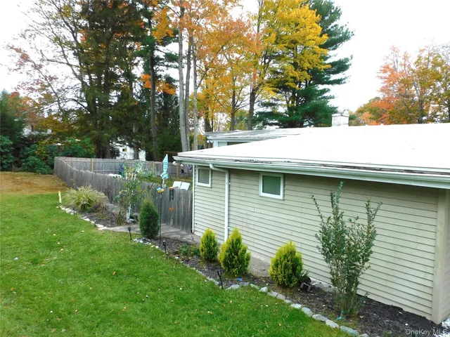 a small garden in the backyard of a house