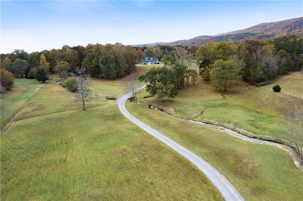 1024 Pocket Road Northwest Sugar Valley, GA 30746 - Photo 1 of 1 a view of a swimming pool with a yard