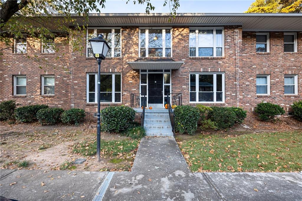 510 Coventry Road, Unit 16D Decatur, GA 30030 - Photo 1 of 1 a front view of a house with garden