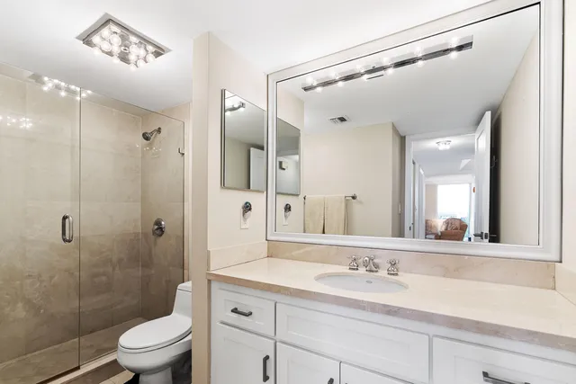 a front view of a multi story building with yard