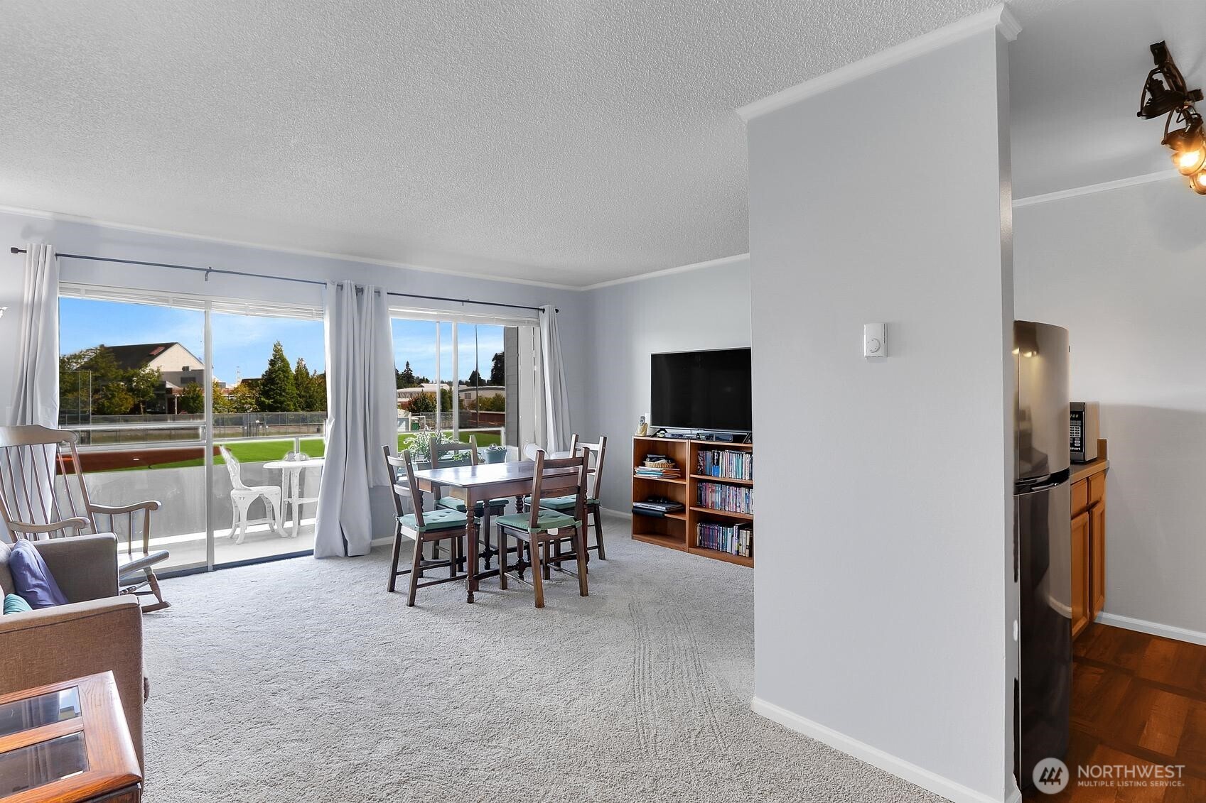 7924 212th Street Southwest, Unit 211 Edmonds, WA 98026 - Photo 4 of 14 a view of a livingroom with furniture window and outside view