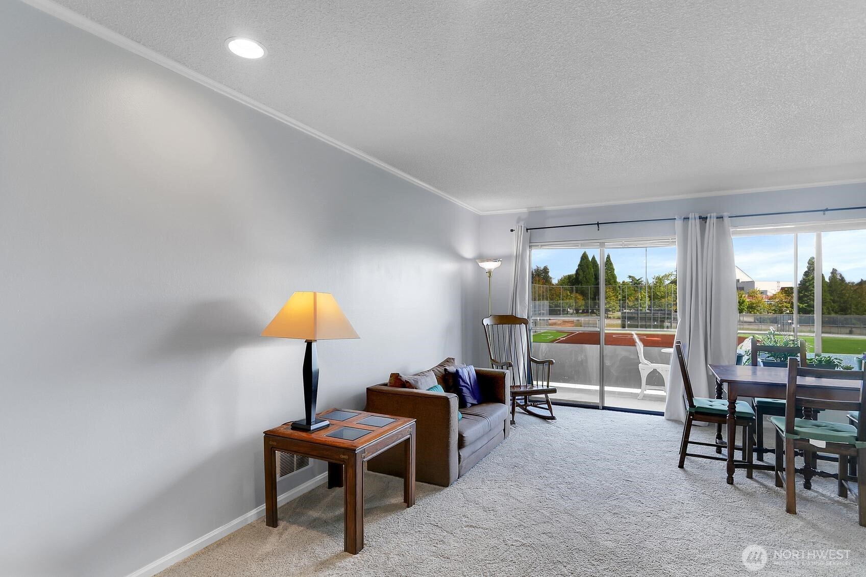 7924 212th Street Southwest, Unit 211 Edmonds, WA 98026 - Photo 5 of 14 a living room with furniture and a table
