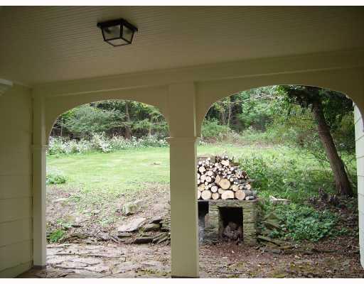 570 Sangree Road Pittsburgh, PA 15237 - Photo 7 of 8 Patio/Deck. Arched breezeway from house to garage frames the rear yard.