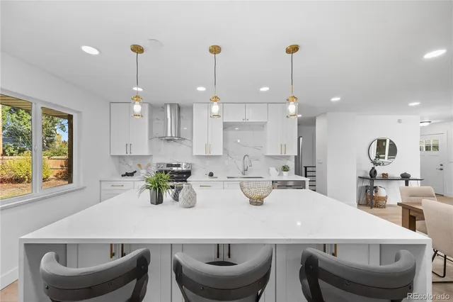 a kitchen with a dining table and chairs