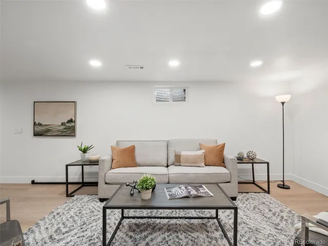 a living room with furniture and a rug