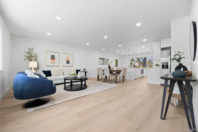 a living room with furniture and a table