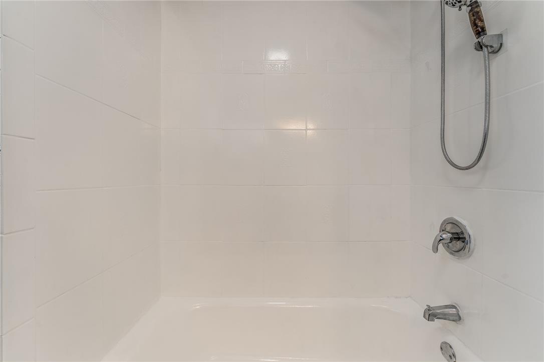 1331 Ridge Trail Easton, PA 18040 - Photo 15 of 22 A pristine white tiled shower/tub combination offers a clean and refreshing bathing experience.
