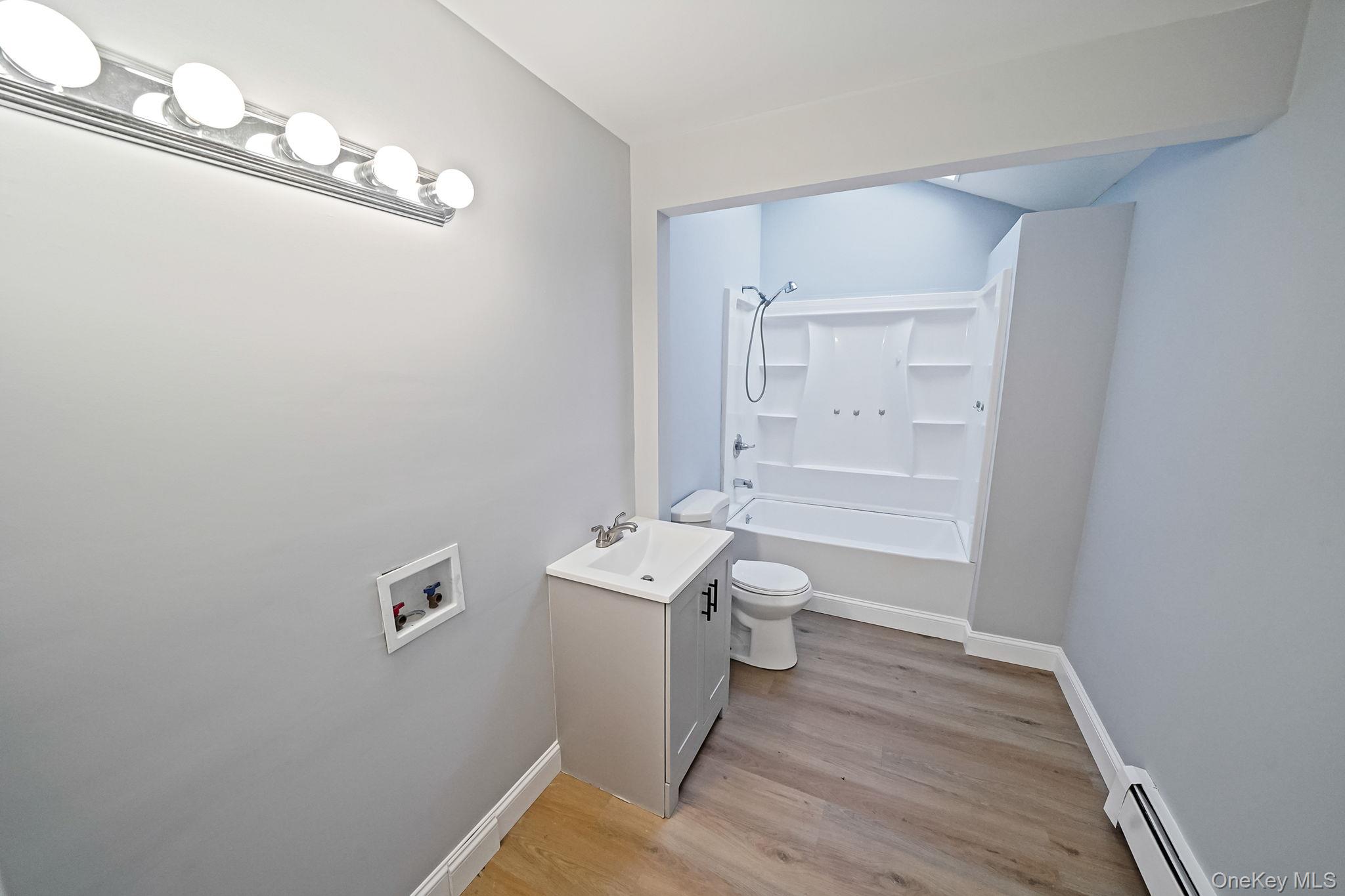 139 Madison Street Mastic, NY 11950 - Photo 21 of 38 full bathroom with w/d hookup
