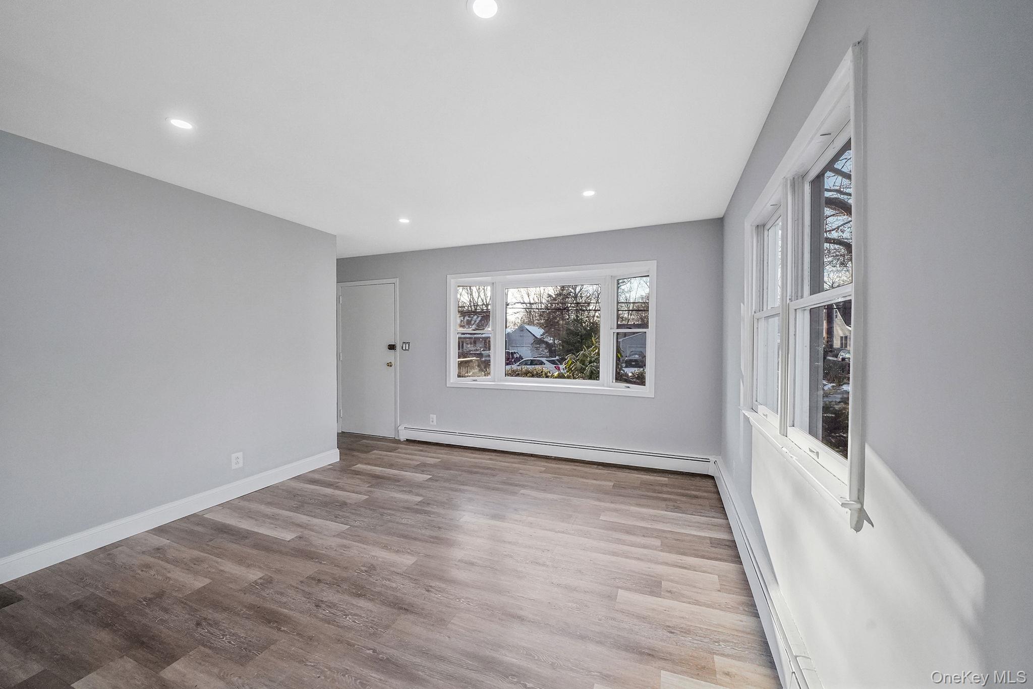 139 Madison Street Mastic, NY 11950 - Photo 6 of 38 view of living room from dining area
