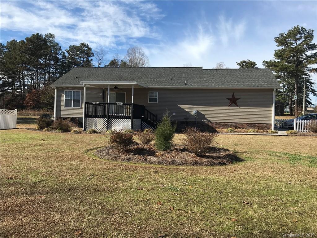 5815 Faith Road Salisbury, NC 28146 - Photo 14 of 16 a front view of a house with a yard