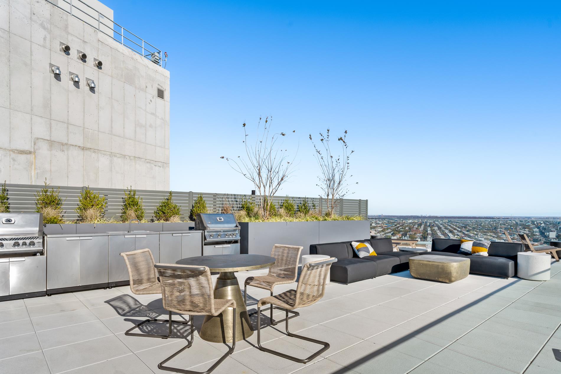 545 Vanderbilt Avenue, Unit PH3C Brooklyn, NY 11238 - Photo 14 of 16 a outdoor space with lots of tables a chairs and a stove