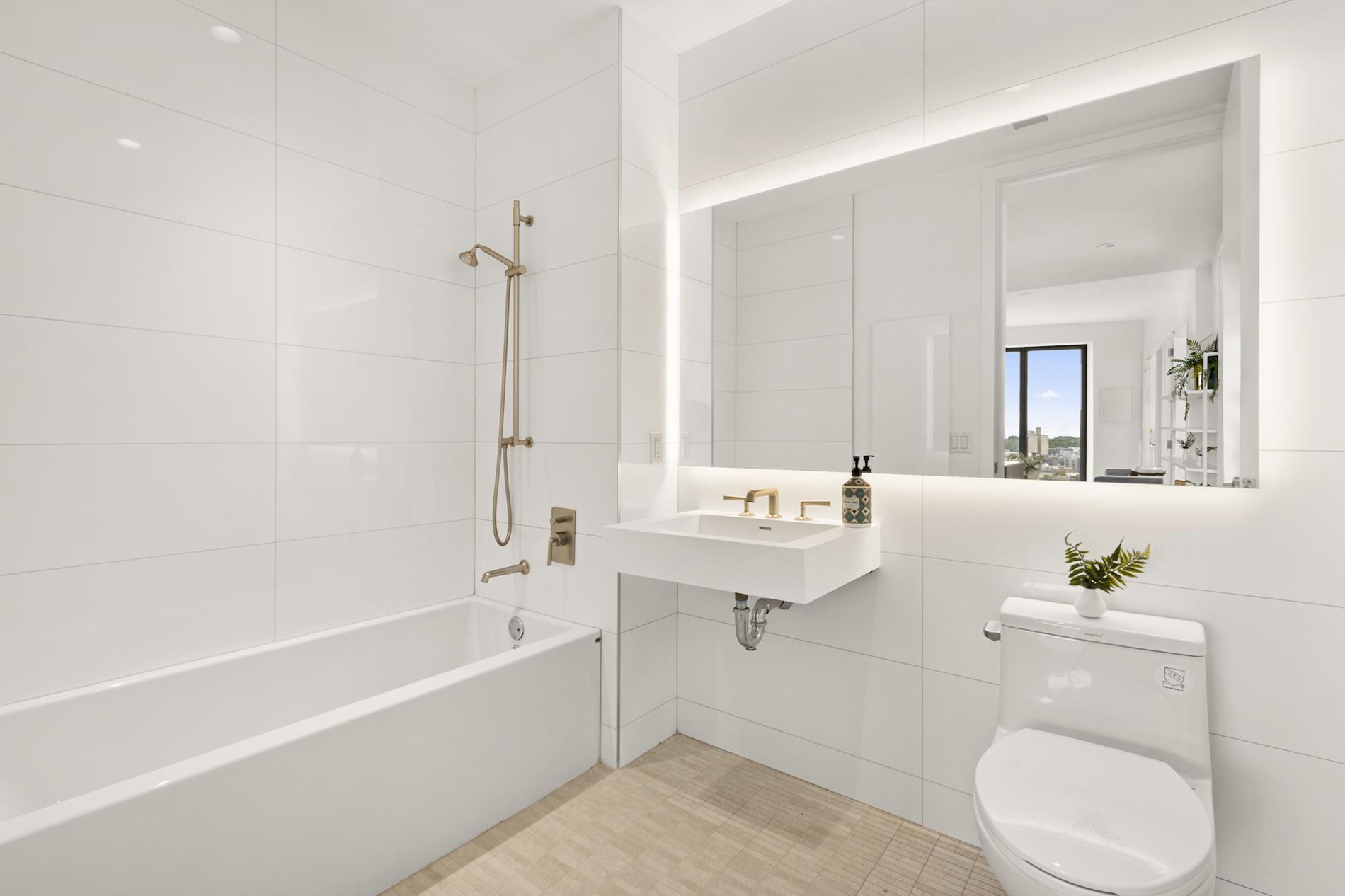 545 Vanderbilt Avenue, Unit PH3C Brooklyn, NY 11238 - Photo 4 of 16 a bathroom with a sink a toilet and shower