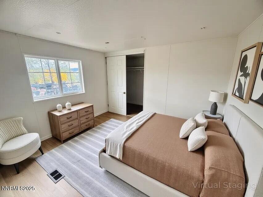 3855 Sandpiper Drive Reno, NV 89508 - Photo 14 of 28 a bedroom with bed and a couch