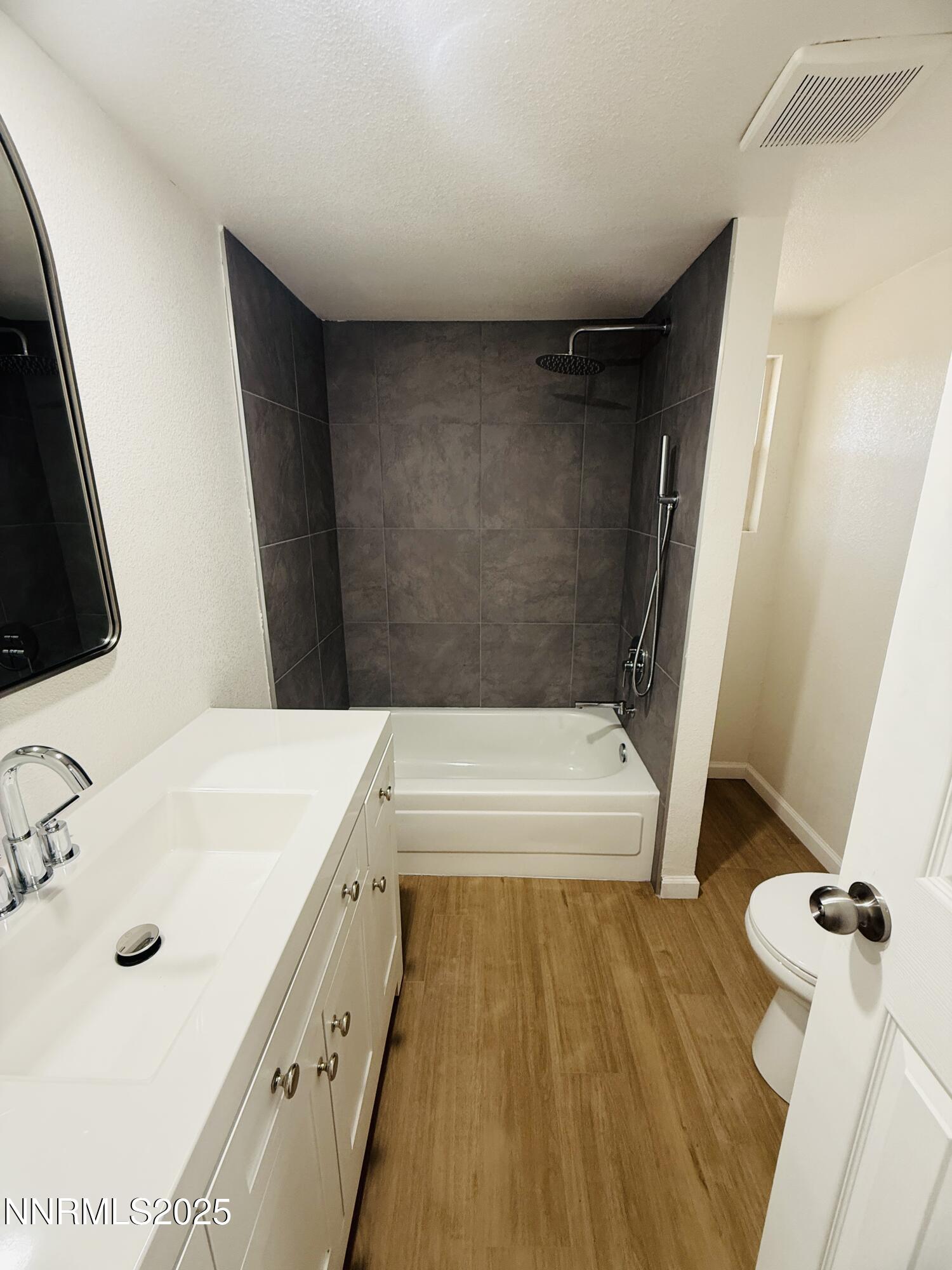 3855 Sandpiper Drive Reno, NV 89508 - Photo 15 of 28 a bathroom with a tub sink and mirror