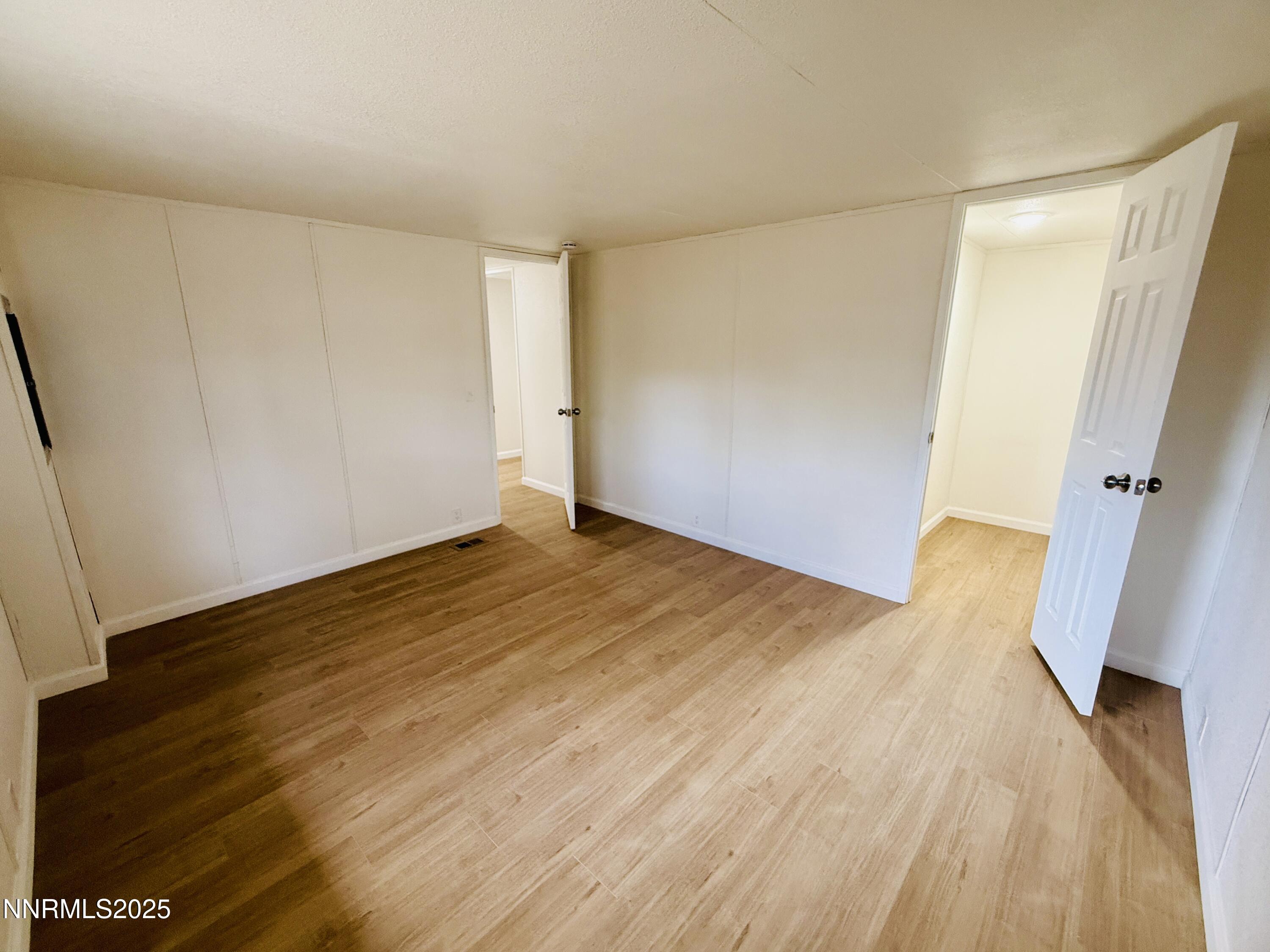 3855 Sandpiper Drive Reno, NV 89508 - Photo 21 of 28 a view of empty room with wooden floor