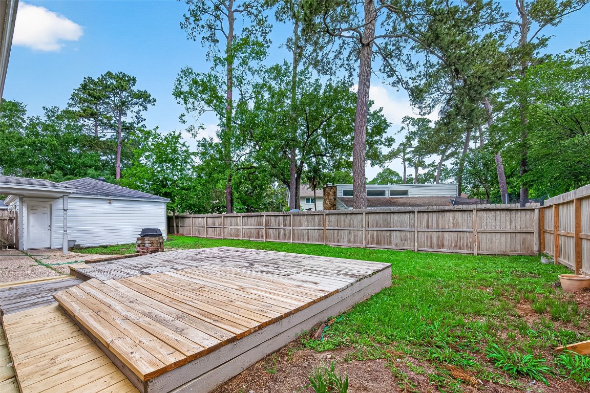 4230 Annawood Circle Spring, TX 77388 - Photo 16 of 50 a view of a backyard with a wooden fence