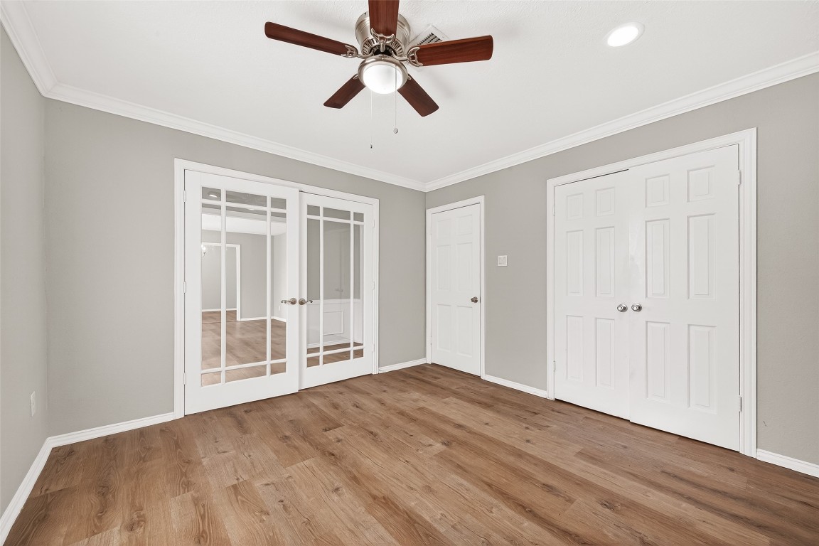 4230 Annawood Circle Spring, TX 77388 - Photo 18 of 50 an empty room with wooden floor ceiling fan and windows