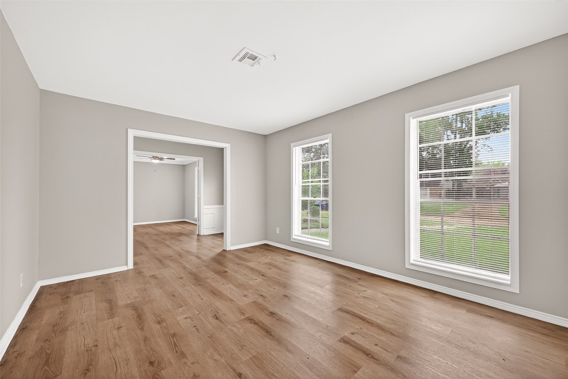 4230 Annawood Circle Spring, TX 77388 - Photo 20 of 50 an empty room with wooden floor and windows