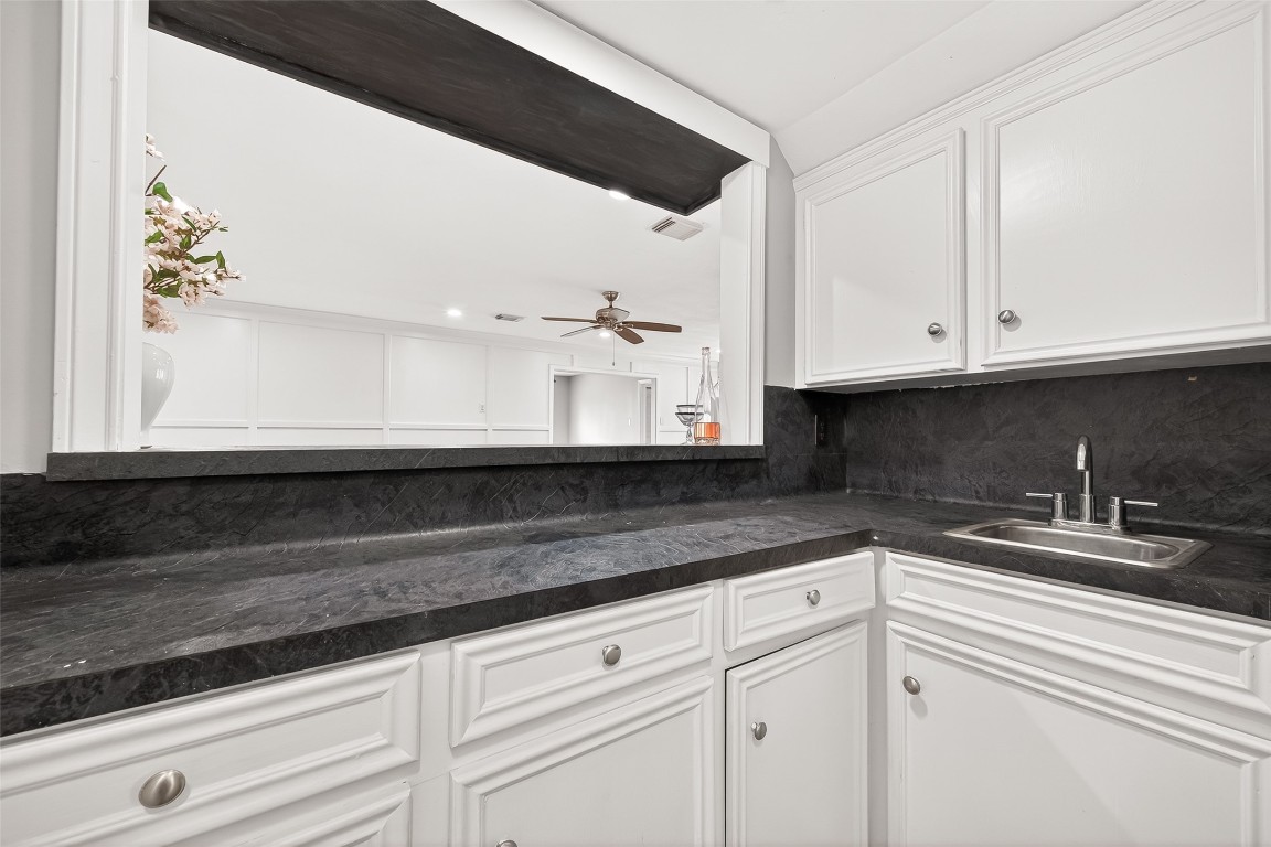 4230 Annawood Circle Spring, TX 77388 - Photo 3 of 50 a kitchen with granite countertop white cabinets and a sink