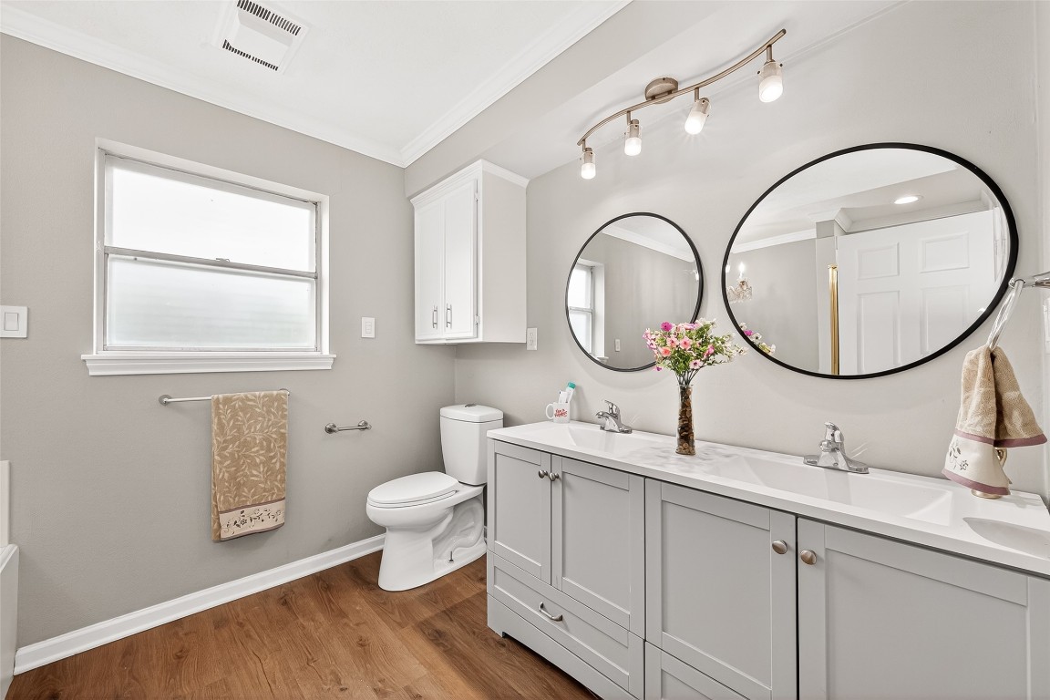 4230 Annawood Circle Spring, TX 77388 - Photo 4 of 50 a bathroom with a toilet a sink and a mirror