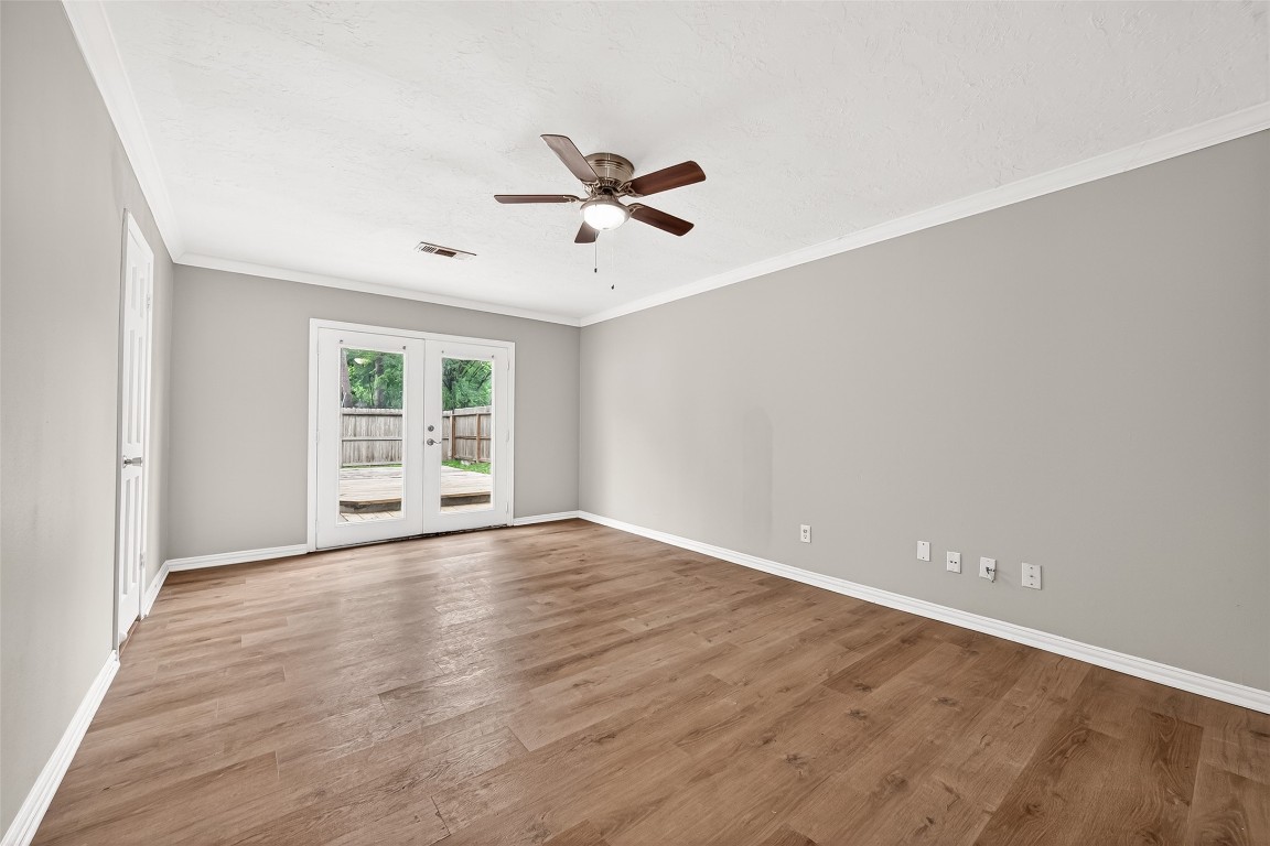 4230 Annawood Circle Spring, TX 77388 - Photo 41 of 50 an empty room with wooden floor fan and windows