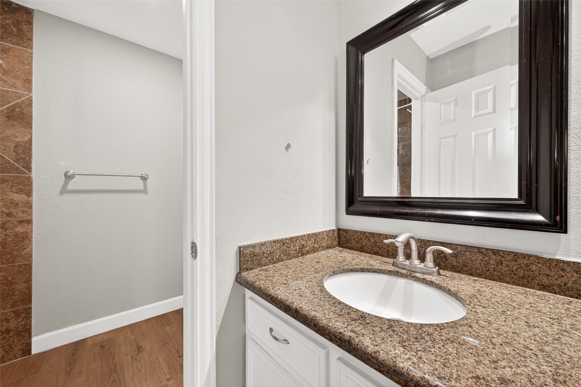 4230 Annawood Circle Spring, TX 77388 - Photo 7 of 50 a bathroom with a granite countertop sink and a mirror