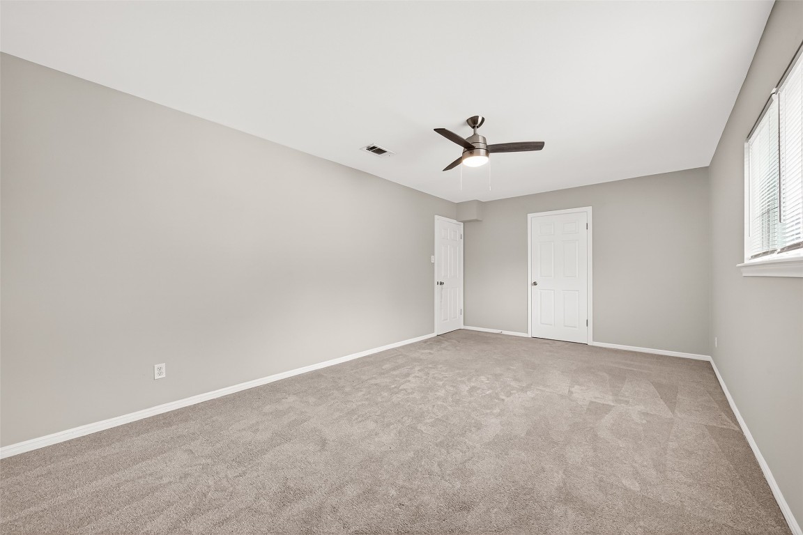 4230 Annawood Circle Spring, TX 77388 - Photo 10 of 50 an empty room with a ceiling fan and window
