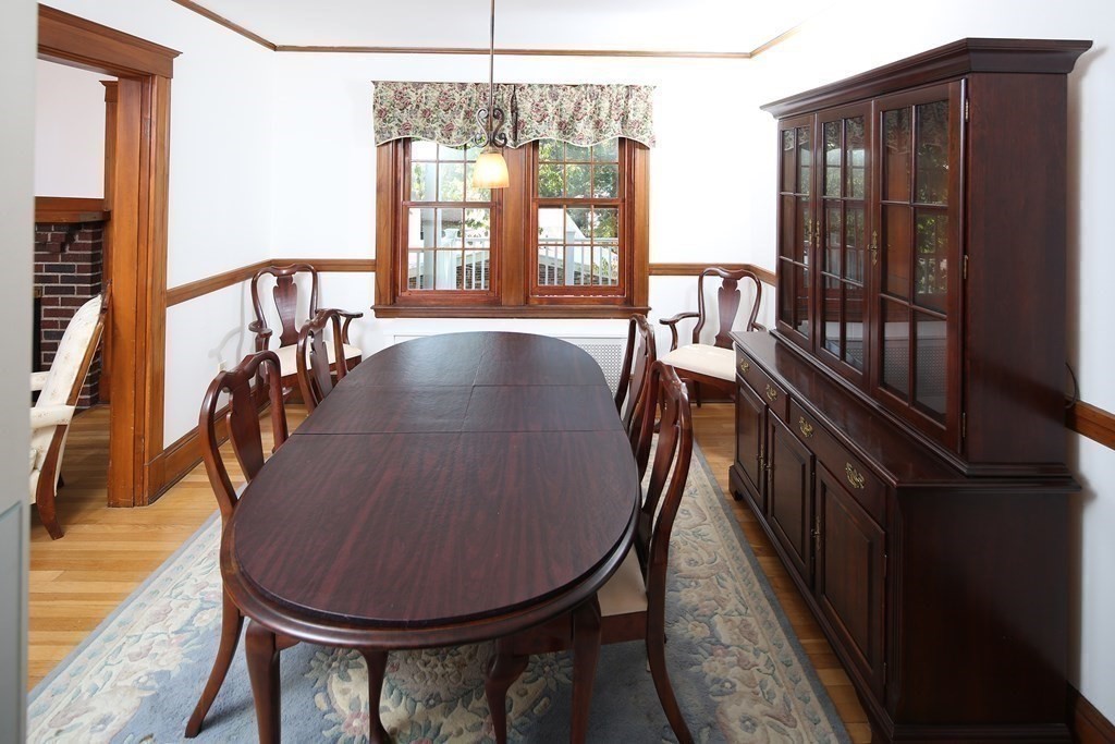 105 Athelstane Road, Unit 2 Newton, MA 02459 - Photo 8 of 35 a view of a dining room with furniture window and wooden floor