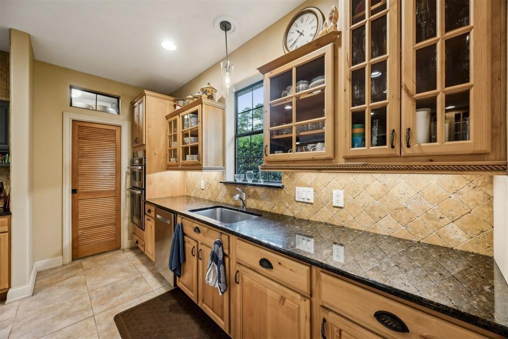 96022 Heath Point Lane Fernandina Beach, FL 32034 - Photo 16 of 39 a kitchen with stainless steel appliances granite countertop a sink and a white cabinets