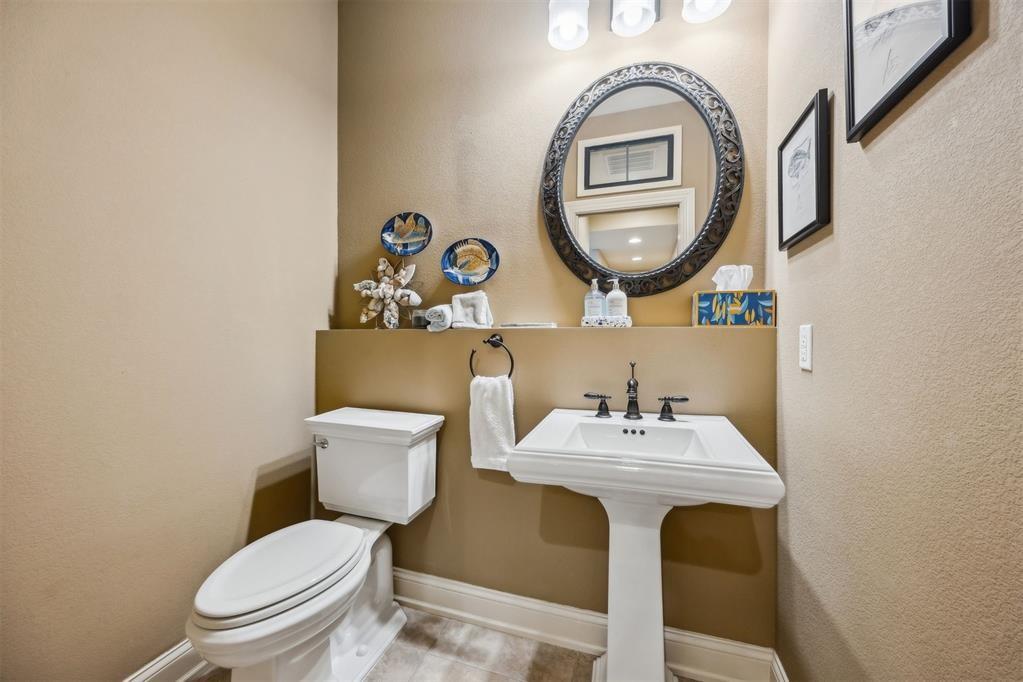 96022 Heath Point Lane Fernandina Beach, FL 32034 - Photo 20 of 39 a bathroom with a toilet a sink and a mirror