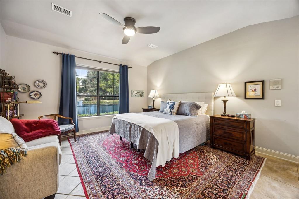 96022 Heath Point Lane Fernandina Beach, FL 32034 - Photo 21 of 39 a bed room with a bed and a couch