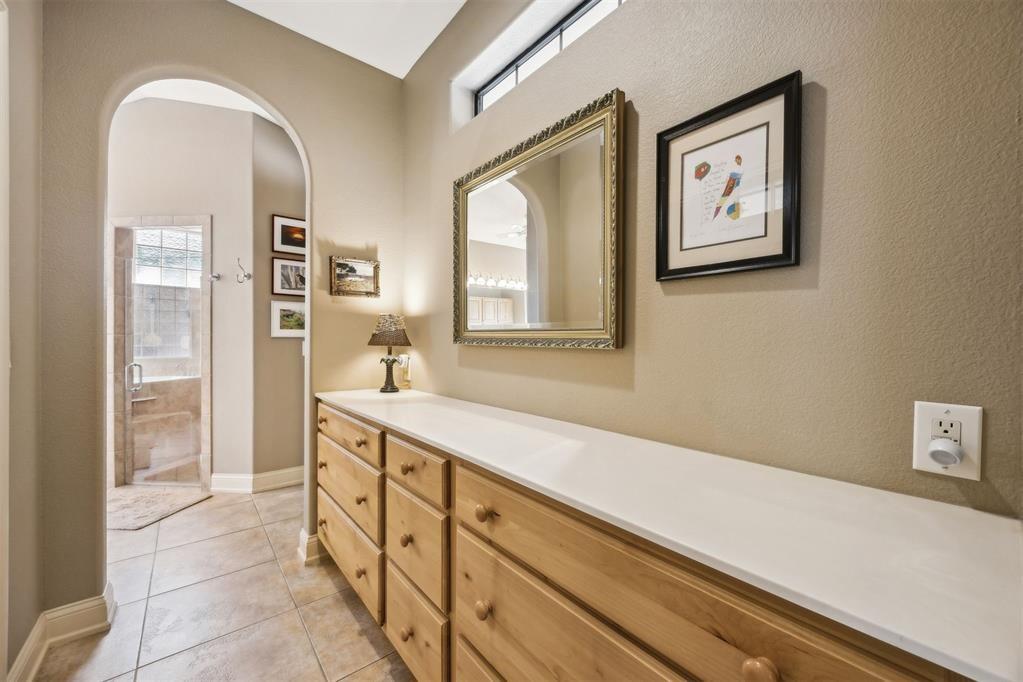 96022 Heath Point Lane Fernandina Beach, FL 32034 - Photo 23 of 39 a spacious bathroom with a double vanity sink and a mirror