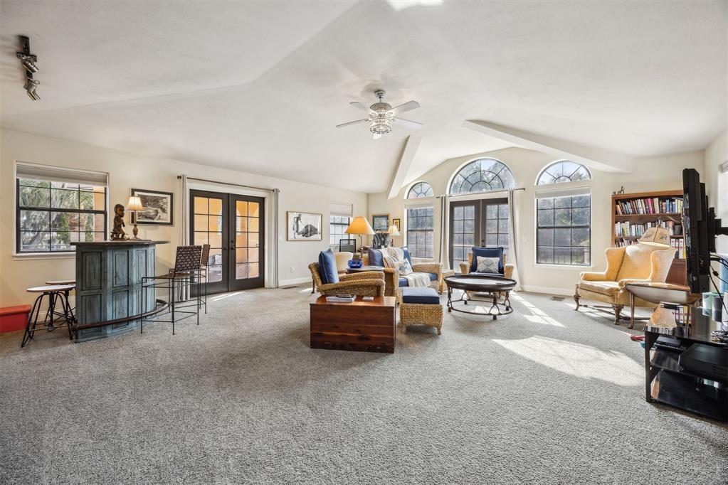 96022 Heath Point Lane Fernandina Beach, FL 32034 - Photo 28 of 39 a living room with furniture gym equipment and a large window