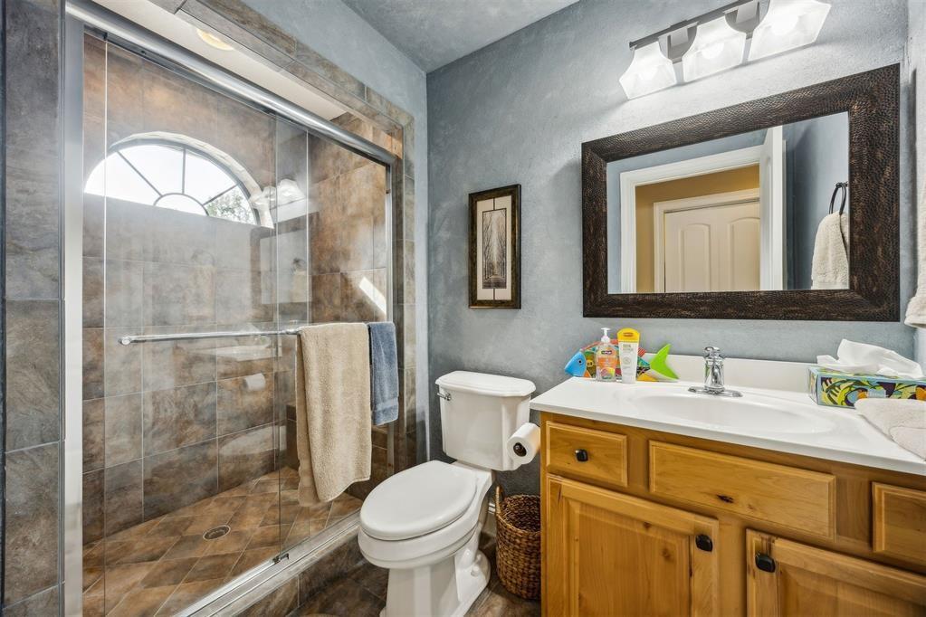 96022 Heath Point Lane Fernandina Beach, FL 32034 - Photo 30 of 39 a bathroom with a toilet sink and shower