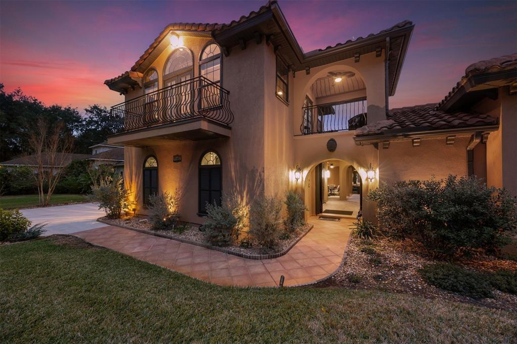 96022 Heath Point Lane Fernandina Beach, FL 32034 - Photo 31 of 39 a front view of a house with garden