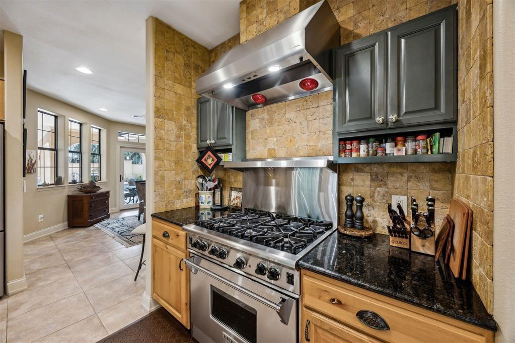 96022 Heath Point Lane Fernandina Beach, FL 32034 - Photo 4 of 39 a kitchen with stainless steel appliances granite countertop a stove and a microwave