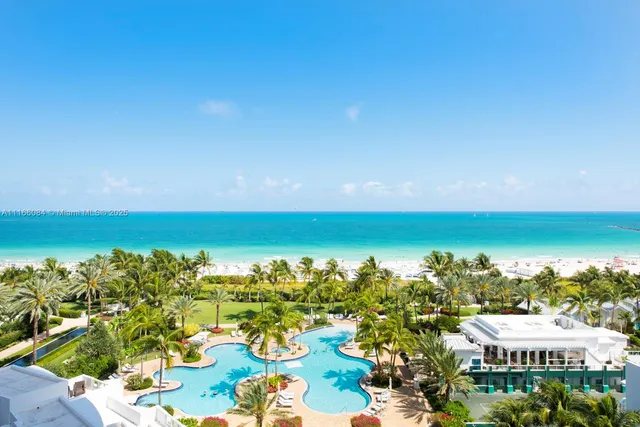 an aerial view of residential building and lake